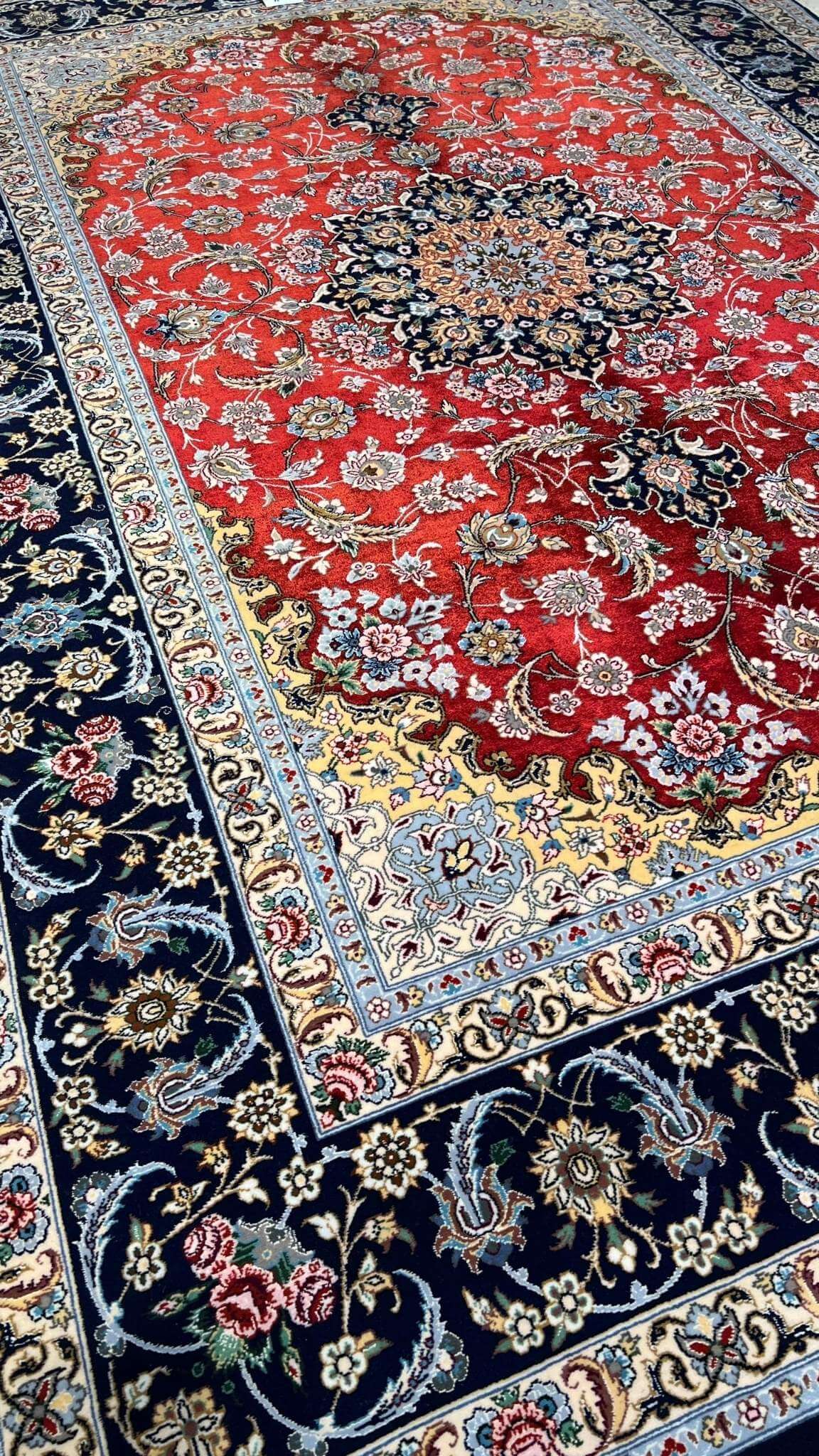 5 x 7 ft hand-knotted red and black Persian rug with silk highlights